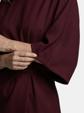 Robe midi portefeuille noire manches ballon ceinture auto-nouée soirée